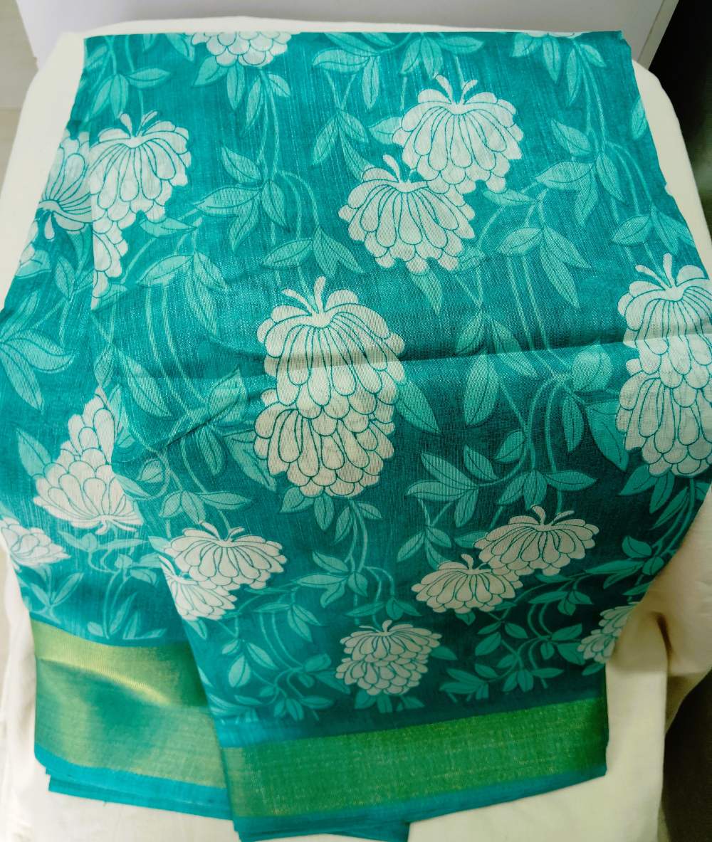 teal green floral print semi cotton saree