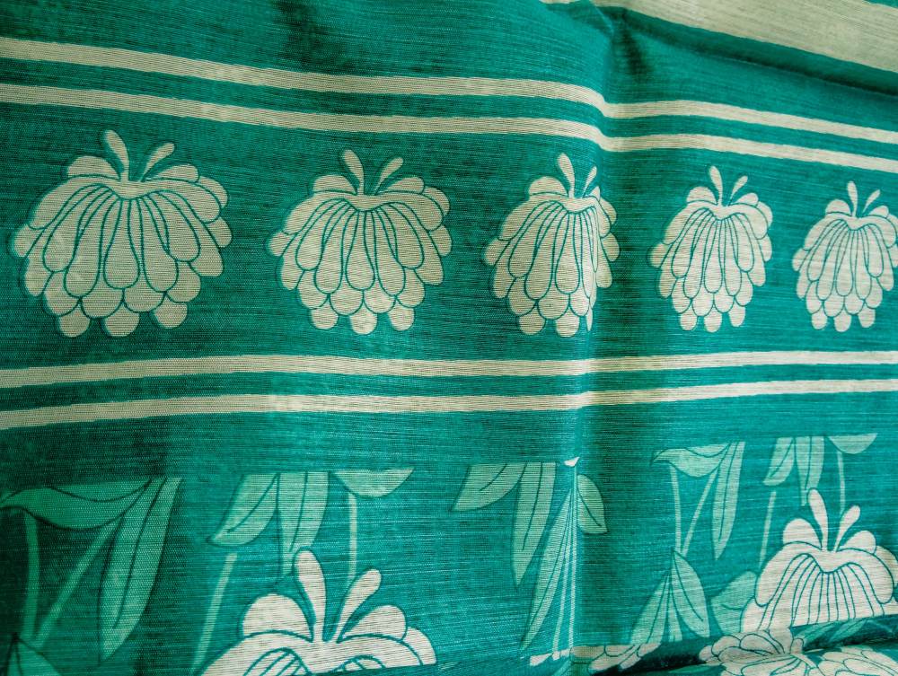 teal green floral print semi cotton saree