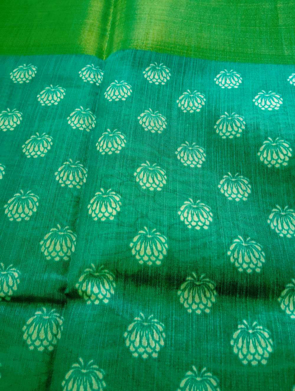teal green floral print semi cotton saree